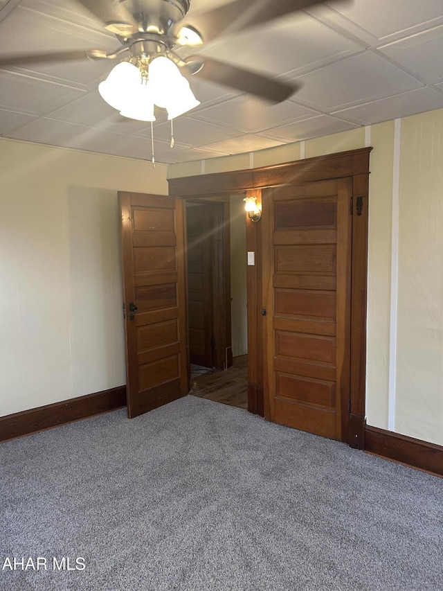 spare room with carpet flooring and ceiling fan