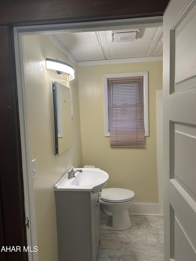 bathroom featuring vanity and toilet