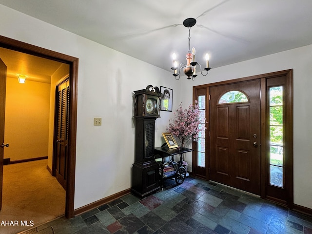 foyer entrance featuring a chandelier