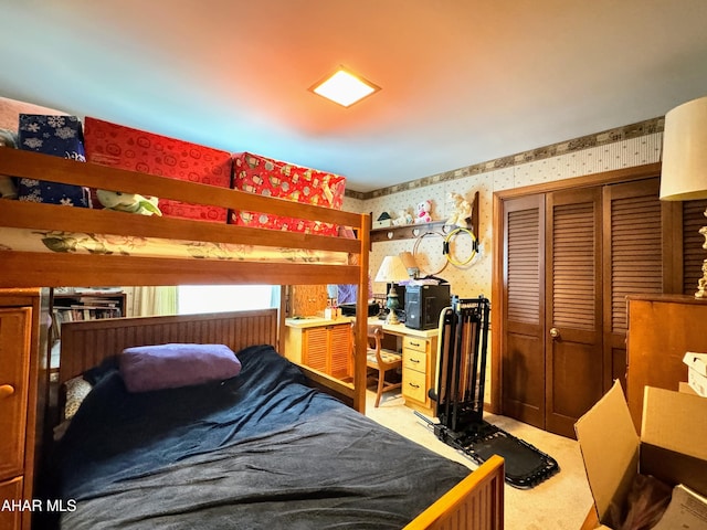 bedroom featuring carpet and a closet