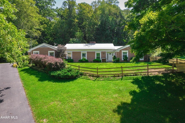 ranch-style house with a front lawn