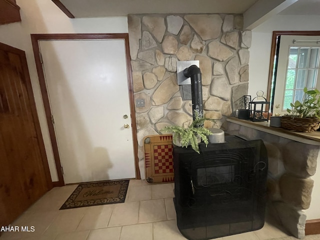 849-853 Fairview Rd, Howard, PA 16841 - foyer entrance with a wood stove and tile patterned floors