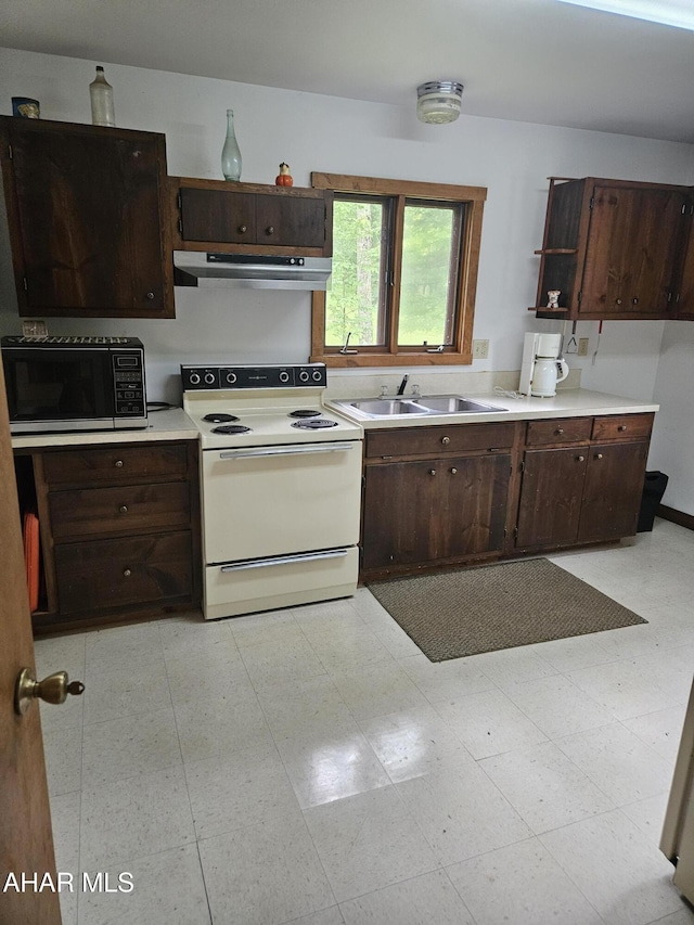 849-853 Fairview Rd, Howard, PA 16841 - kitchen featuring white range with electric cooktop, black microwave, a sink, exhaust hood, and dark brown cabinetry