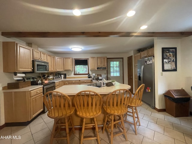 849-853 Fairview Rd, Howard, PA 16841 - kitchen with stainless steel appliances, light countertops, a kitchen bar, light tile patterned flooring, and recessed lighting