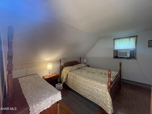 849-853 Fairview Rd, Howard, PA 16841 - bedroom featuring cooling unit, lofted ceiling, a baseboard heating unit, and a textured ceiling