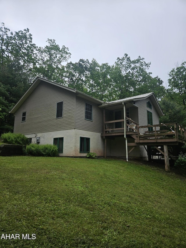 849-853 Fairview Rd, Howard, PA 16841 - rear view of property with a lawn, a wooden deck, and stairs