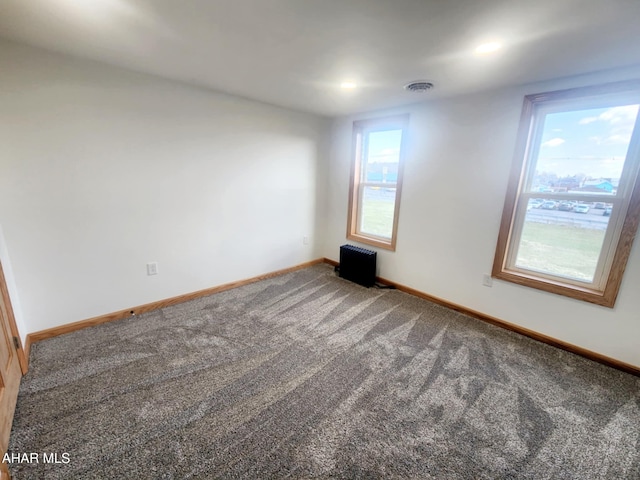 3100 Oak Ave, Altoona, PA 16601 - carpeted spare room with baseboards, visible vents, and radiator