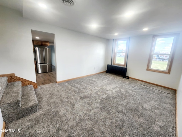 3100 Oak Ave, Altoona, PA 16601 - carpeted spare room featuring stairway, radiator heating unit, baseboards, visible vents, and recessed lighting