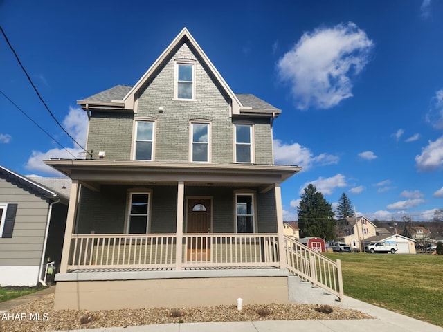 3100 Oak Ave, Altoona, PA 16601 - view of front facade with covered porch, a front lawn, brick siding, and roof with shingles
