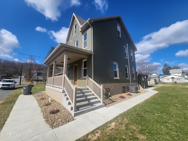3100 Oak Ave, Altoona, PA 16601 - view of front of property featuring central AC unit, a porch, and a front yard
