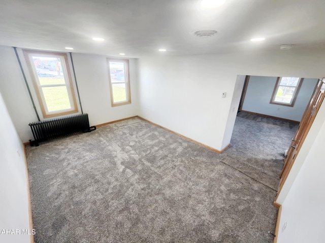 3100 Oak Ave, Altoona, PA 16601 - empty room featuring radiator heating unit, carpet flooring, baseboards, and a wealth of natural light