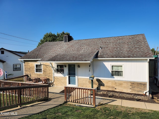 view of front of house featuring a wooden deck