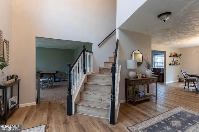 215 Oakwood Dr, Philipsburg, PA 16866 - staircase featuring baseboards and wood finished floors
