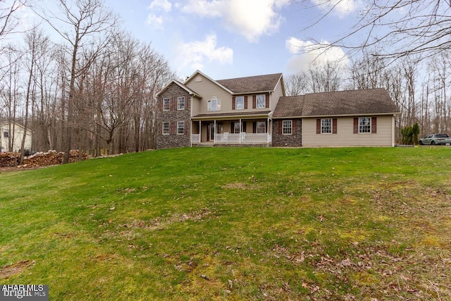 215 Oakwood Dr, Philipsburg, PA 16866 - traditional-style home with a porch, stone siding, and a front yard