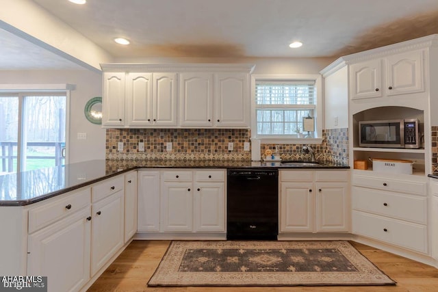 215 Oakwood Dr, Philipsburg, PA 16866 - kitchen with light wood-type flooring, dishwasher, a sink, stainless steel microwave, and a peninsula