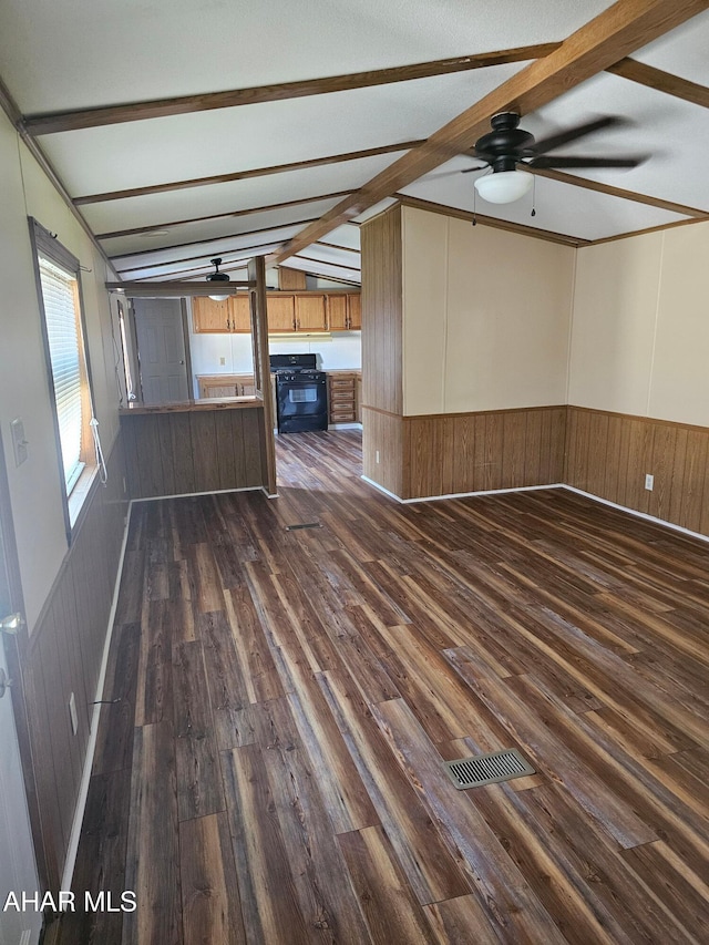2743 Everett Rd, East Freedom, PA 16637 - unfurnished living room with ceiling fan, dark wood-style floors, wooden walls, and wainscoting