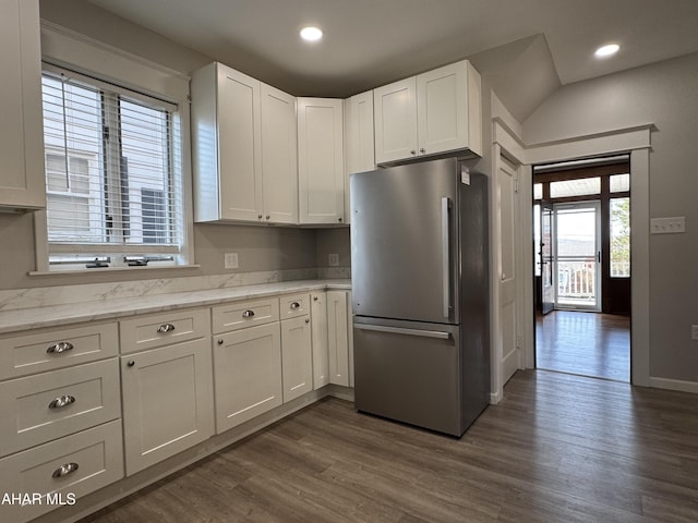 kitchen with white cabinetry, dark wood-type flooring, recessed lighting, and freestanding refrigerator