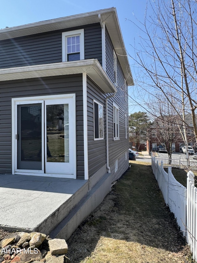 view of side of property with fence