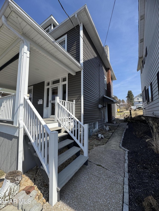 view of side of property featuring a porch