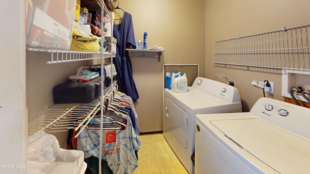 laundry area featuring laundry area and washer and clothes dryer