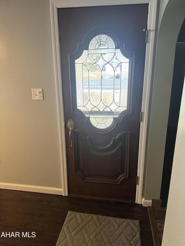 foyer with dark wood-type flooring