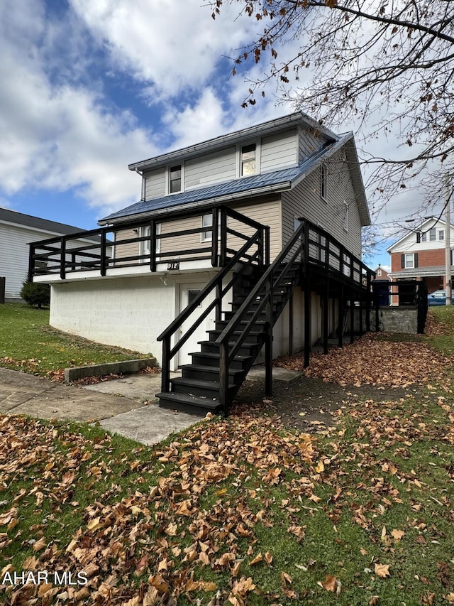 back of house featuring a deck