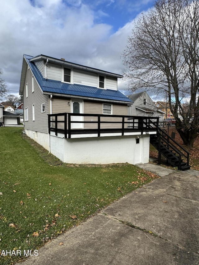 exterior space with a yard and a deck