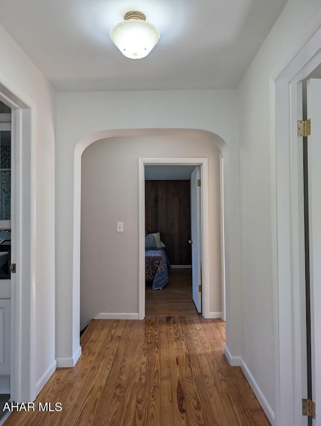 hallway featuring hardwood / wood-style floors