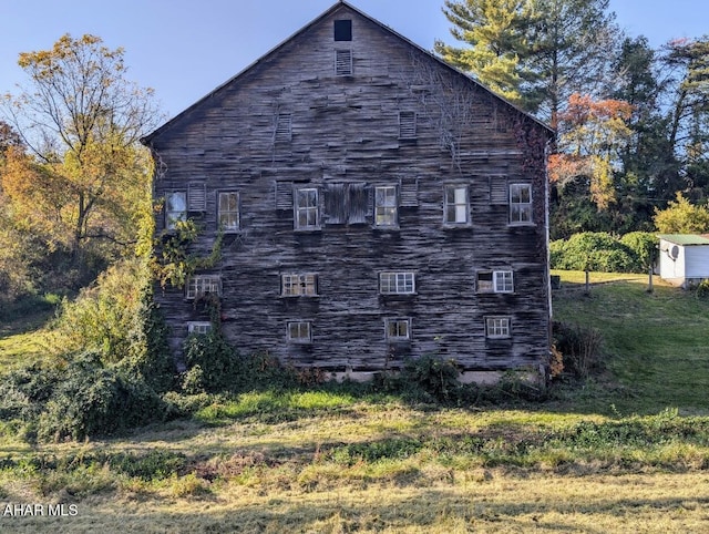 view of home's exterior featuring a shed