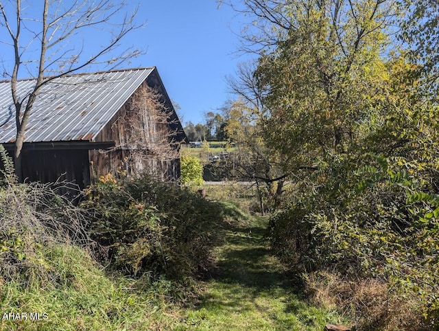 view of home's exterior featuring an outdoor structure