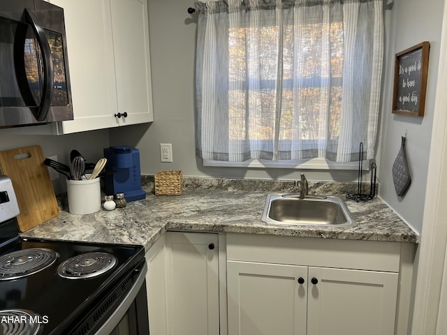 215 E Valley Point Ln, Claysburg, PA 16625 - kitchen featuring black appliances and white cabinetry