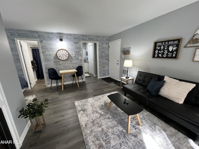 215 E Valley Point Ln, Claysburg, PA 16625 - living area featuring an accent wall and dark wood-type flooring
