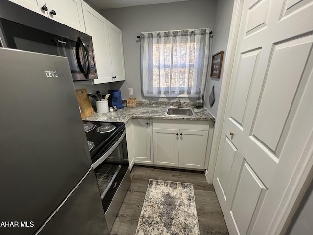 215 E Valley Point Ln, Claysburg, PA 16625 - kitchen with appliances with stainless steel finishes, dark wood-style floors, white cabinets, and light stone countertops