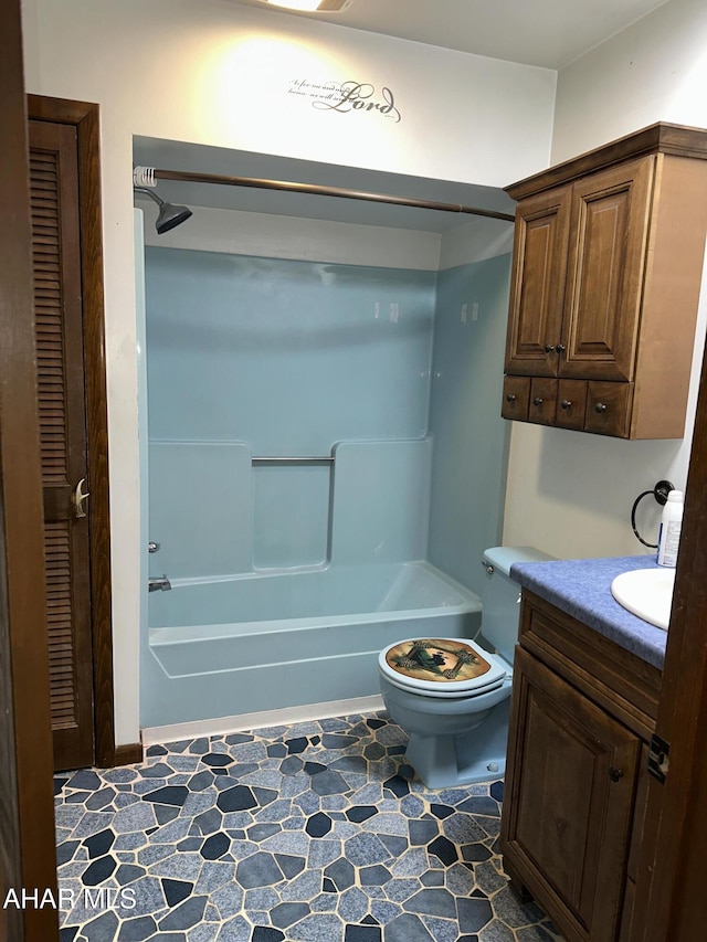 full bathroom featuring bathtub / shower combination, vanity, and toilet