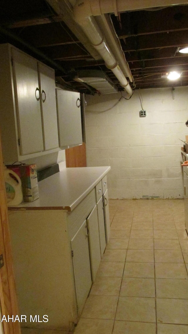 basement with light tile patterned floors