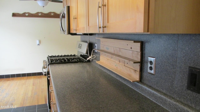 kitchen featuring hardwood / wood-style floors and appliances with stainless steel finishes