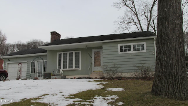 single story home featuring a garage