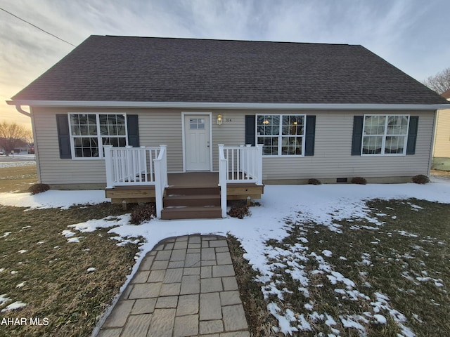 view of front of house featuring a shingled roof