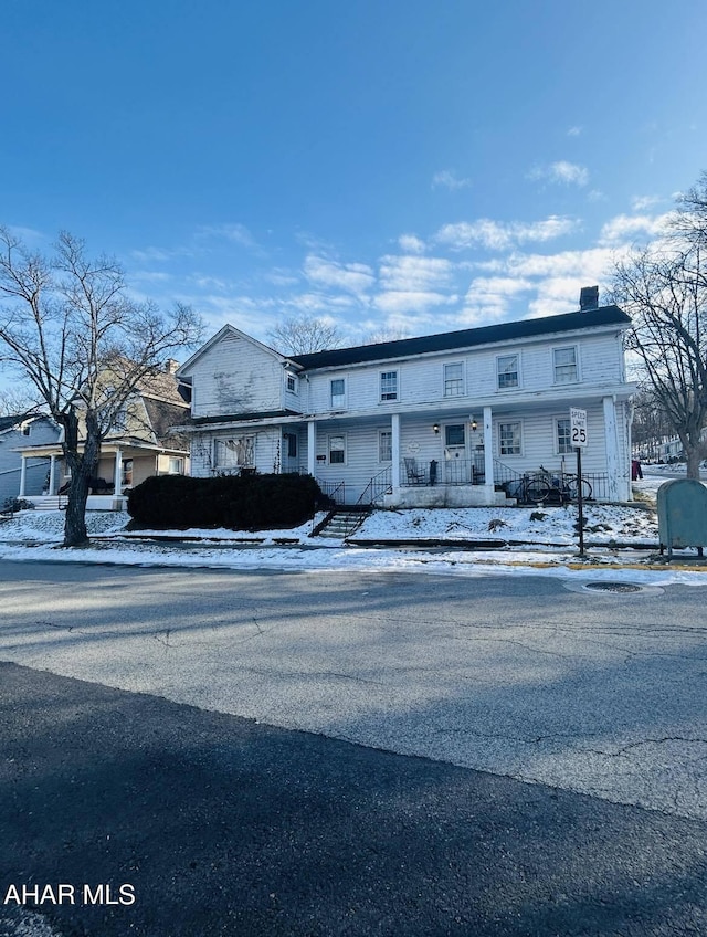 view of front of property featuring a chimney