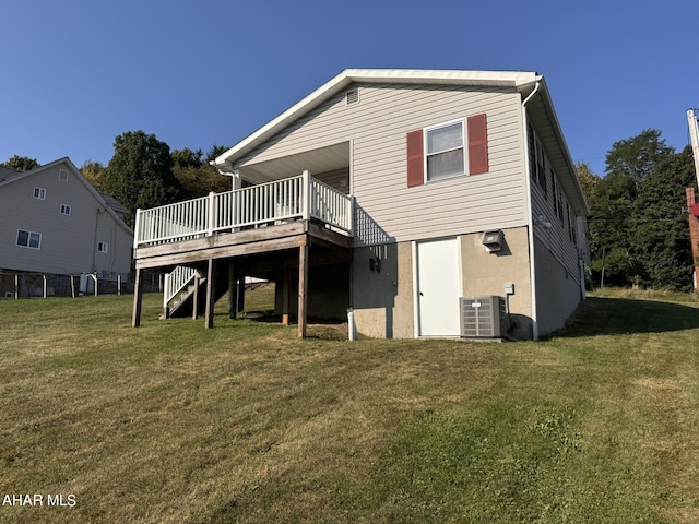 back of house with a yard, central AC unit, and a deck