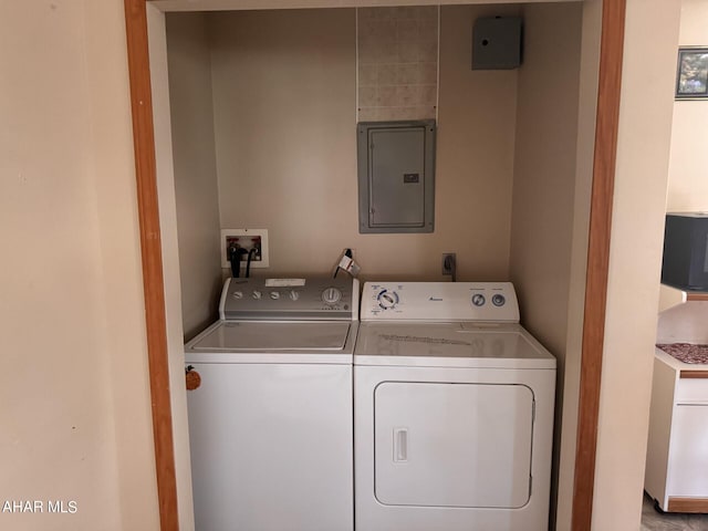 laundry area featuring washing machine and dryer and electric panel