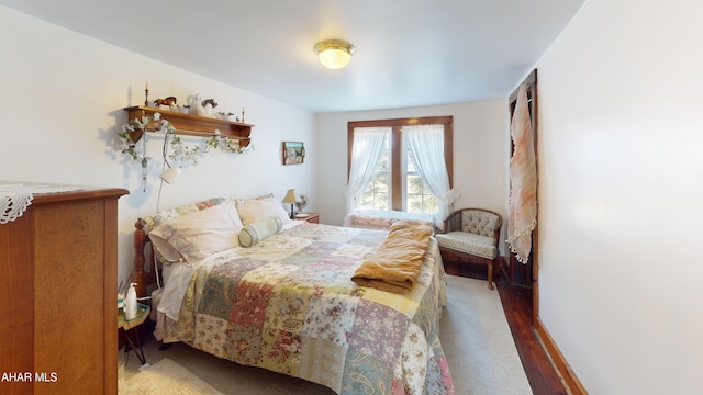 bedroom with wood finished floors