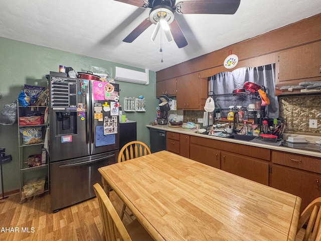 433 Pike Rd, Johnstown, PA 15909 - kitchen featuring freestanding refrigerator, a wall mounted AC, light countertops, dishwasher, and light wood finished floors
