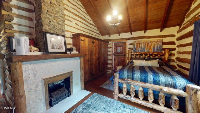 166 Mink Rd, Boswell, PA 15531 - bedroom featuring a wooden ceiling with exposed beams, wood finished floors, a fireplace with raised hearth, and high vaulted ceiling