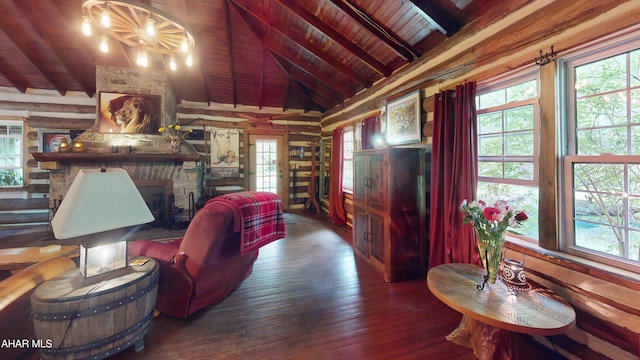 166 Mink Rd, Boswell, PA 15531 - living room with wood ceiling, wood-type flooring, a stone fireplace, wooden walls, and a chandelier
