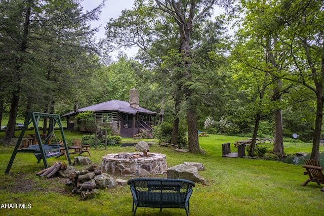 166 Mink Rd, Boswell, PA 15531 - view of green lawn with an outdoor fire pit and a wooded view