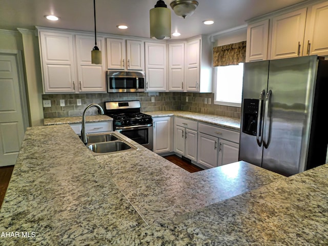 115 Spruce St, Smithmill, PA 16680 - kitchen featuring appliances with stainless steel finishes, a sink, decorative backsplash, decorative light fixtures, and recessed lighting