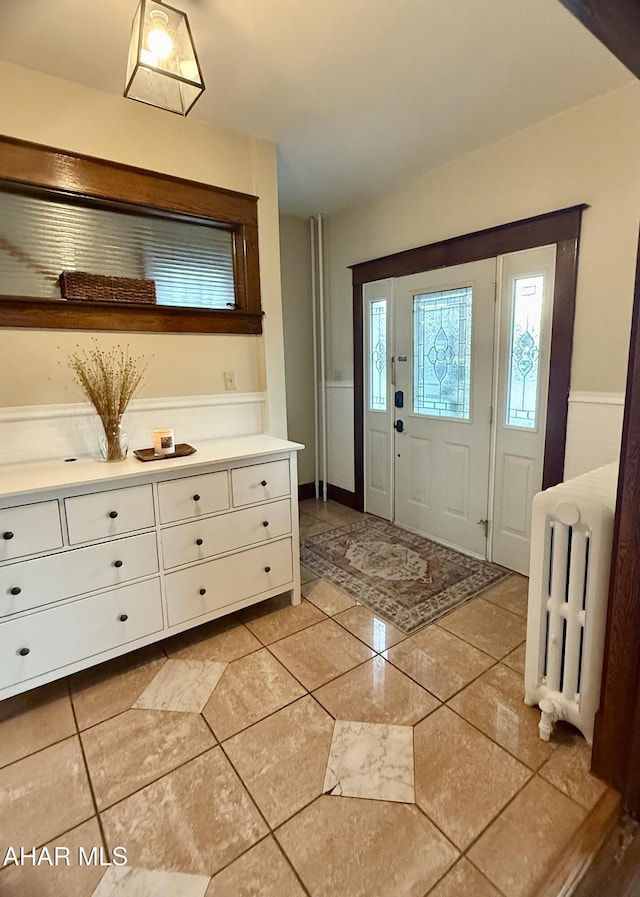 entrance foyer featuring radiator heating unit