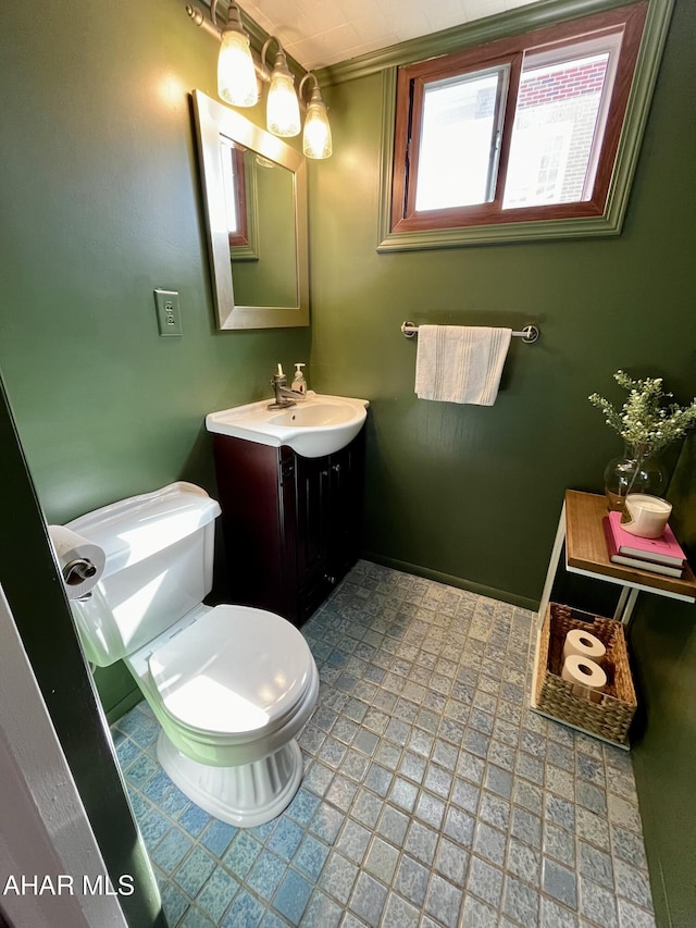 bathroom featuring vanity and toilet