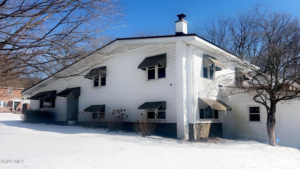 view of snow covered property